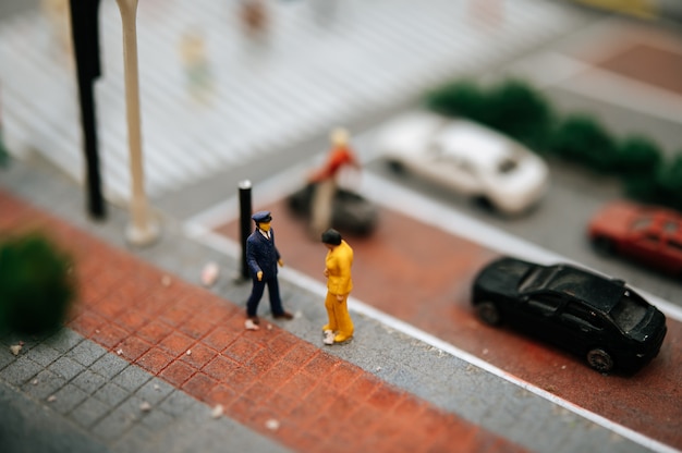 Close up of small traffic police inspect motorists.