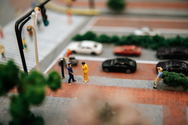 Close up of small traffic police inspect motorists.