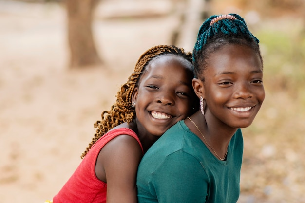 Close-up smiley african girls outdoors