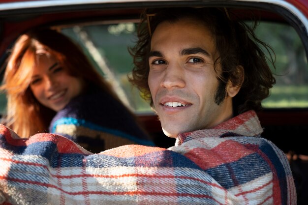 Close up smiley couple in car