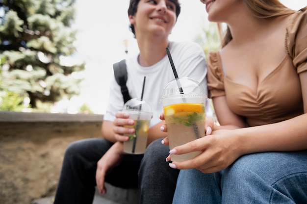 Close up smiley couple with drinks