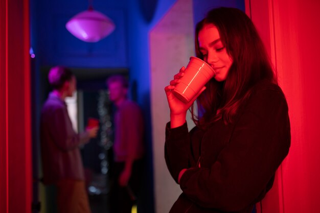 Close up smiley girl holding cup