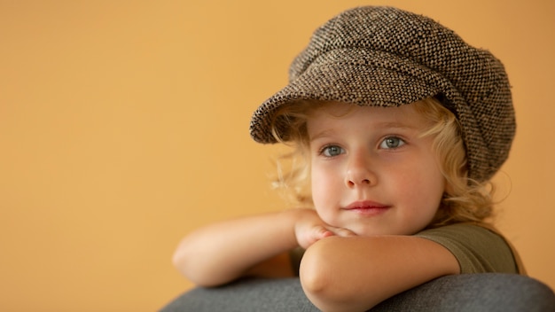 Free Photo close up smiley girl wearing hat