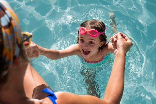 Close up smiley girl with pink goggles