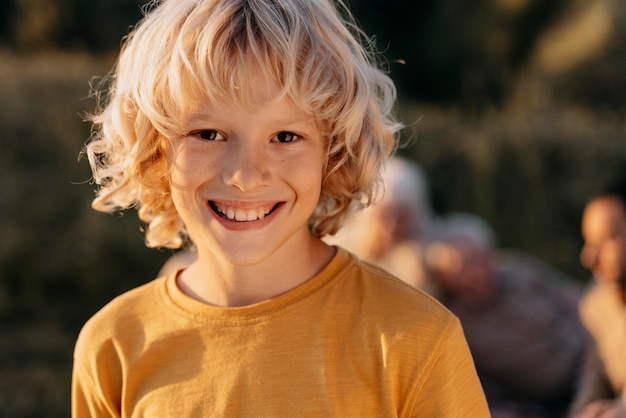 Close up smiley kid outdoors