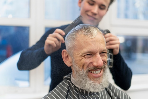 Close up smiley man at hair salon