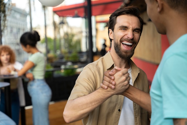 Free Photo close up smiley man saluting