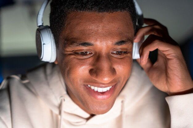 Close up smiley man wearing headphones