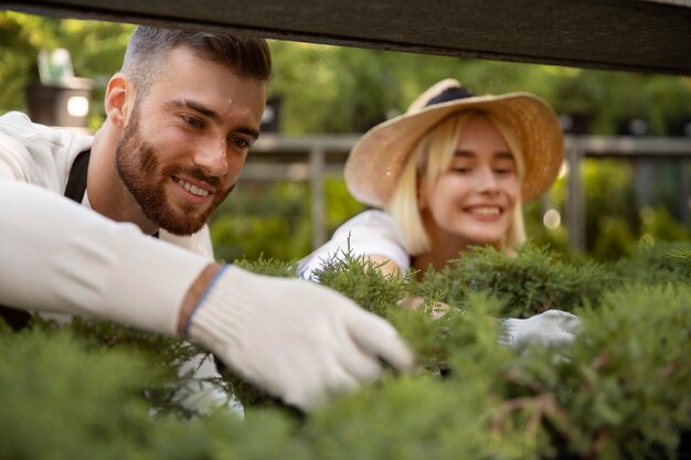 Close up smiley people at greenhouse