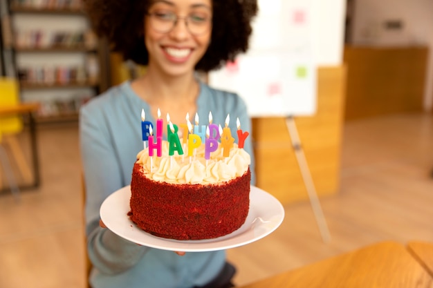 Close up smiley woman holding cake