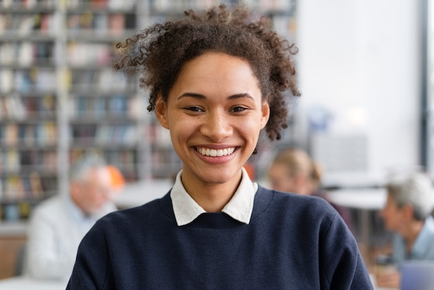 Close up smiley woman in library