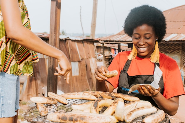 Free photo close-up smiley woman making food