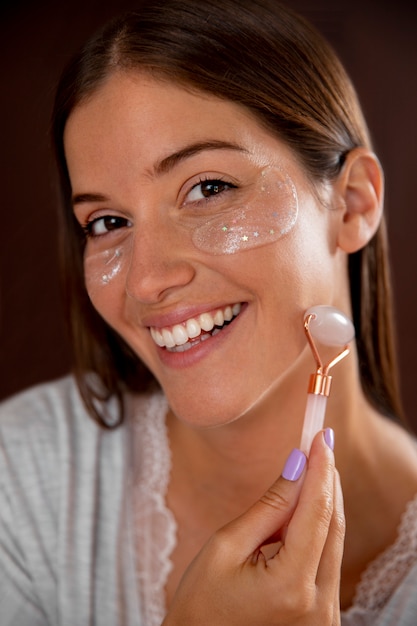 Close up smiley woman massaging face