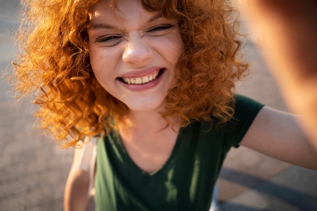 Free Photo close up smiley woman outdoors