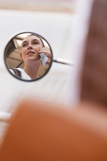 Close up smiley woman talking on phone