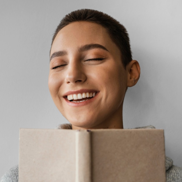 Close-up smiley woman with  notebook