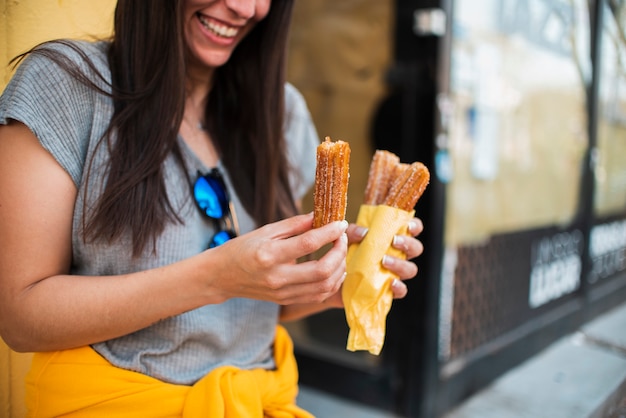 Free photo close-up smiley woman with sweets