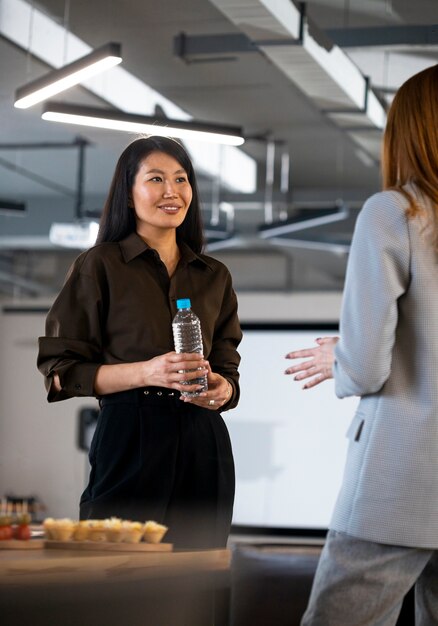 Close up smiley women chatting at event