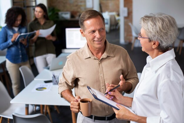 Close up on smiling person in conference room