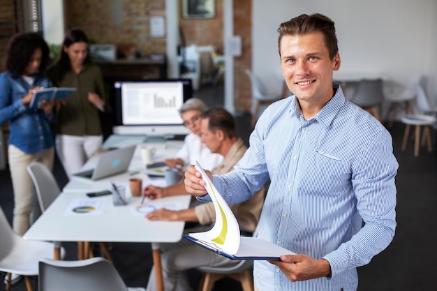 Close up on smiling person in conference room