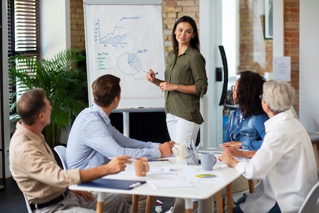 Close up on smiling person in conference room