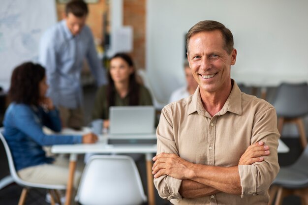 Close up on smiling person in conference room