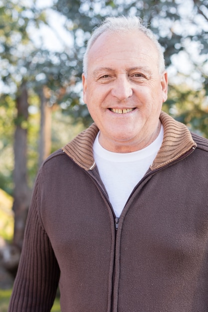 Close-up of smiling retired man