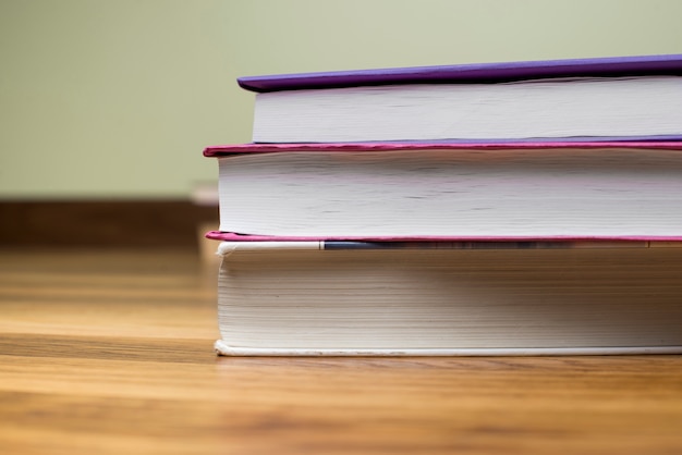 Close-up of some books on wooden surface