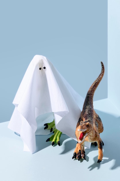 Close-up spooky halloween ghost and dinosaur toys