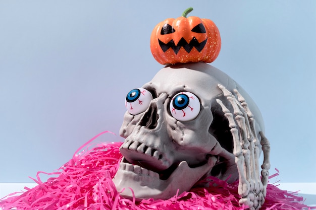 Free Photo close-up spooky halloween skeleton with confetti