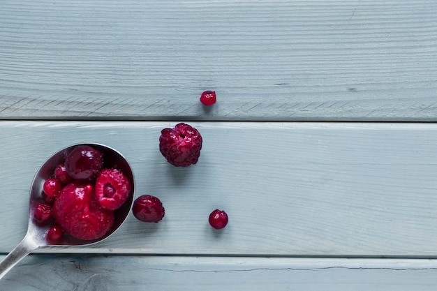 Free Photo close-up spoon with berries