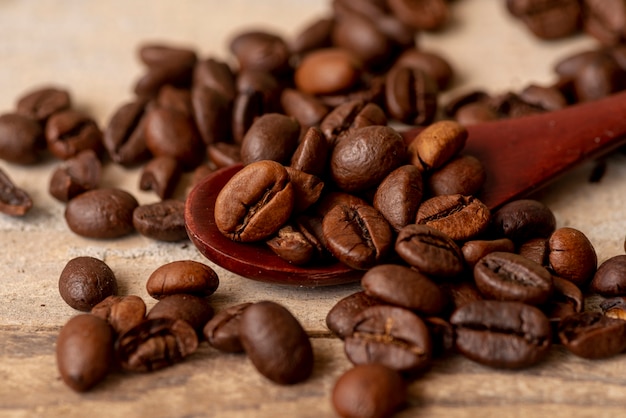 Close-up spoon with roasted coffee beans