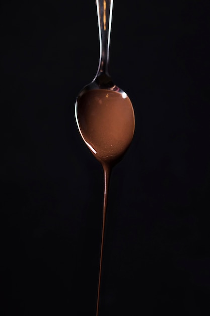 Free photo close-up spoon with tasty chocolate mousse