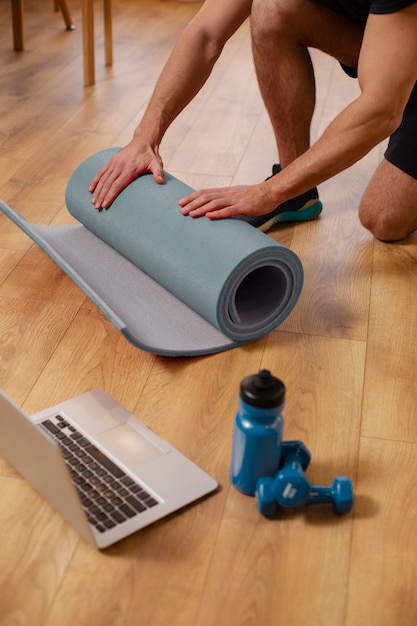 Close up sport instructor with yoga mat