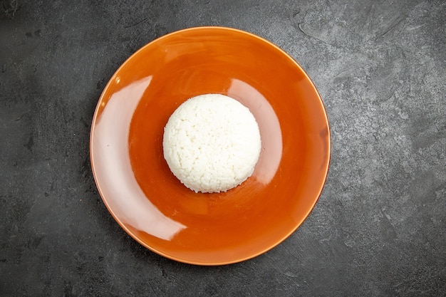 Close up on steamed rice meal on a brown plate