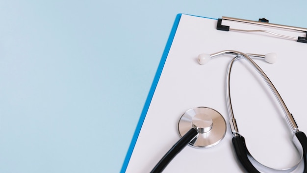 Close-up stethoscope on clipboard