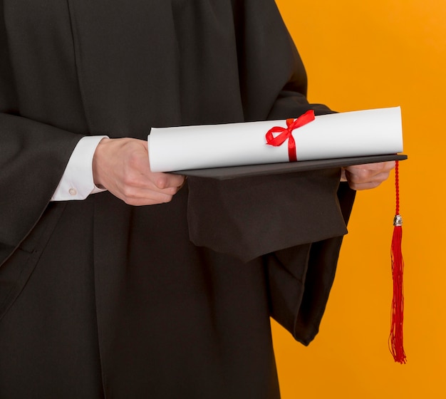 Free photo close up student holding diploma