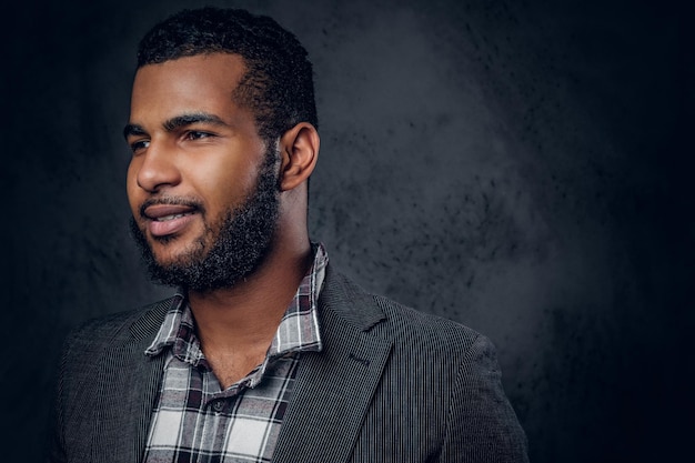 Free photo close up studio portrait of black bearded male over grey background.