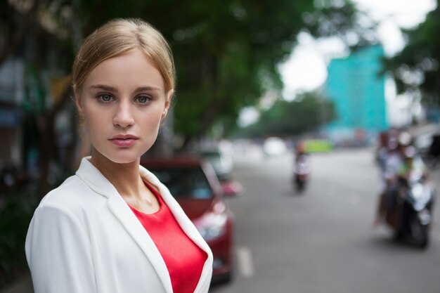 Free Photo close up of stylish serious young woman in street