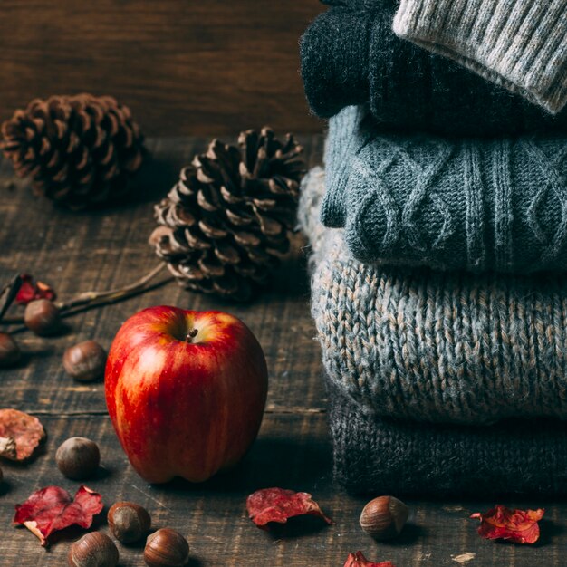 Close-up sweaters with an apple