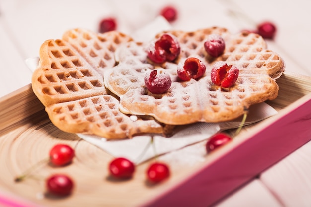 Free Photo close up of sweet waffles with cherry
