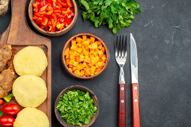 Close up on tasty cutlets chopped vegetables