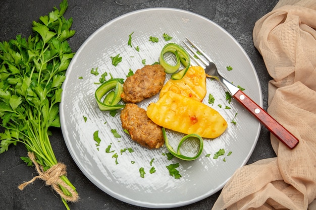 Close up on tasty cutlets chopped vegetables