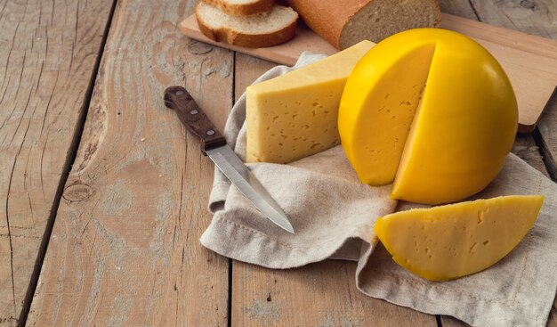 Close-up tasty homemade cheese with a knife