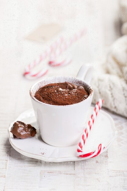 Close-up of tasty hot chocolate with candy cane