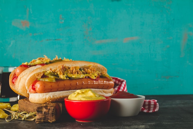 Free Photo close-up of tasty hot dogs with sauces