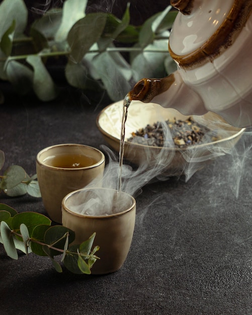 Free Photo close-up teacup pouring tea