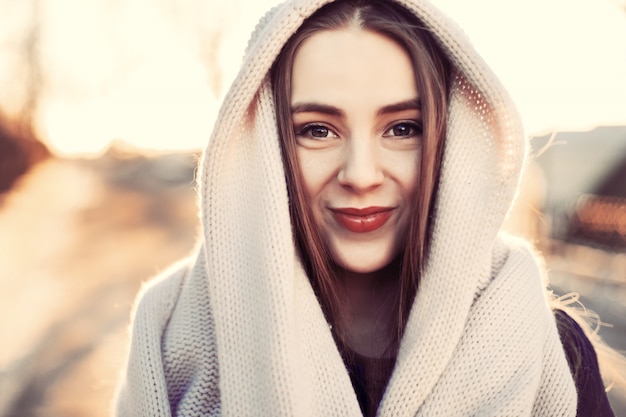 Close-up of teen covering her head with a scarf