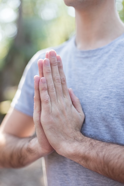 Close-up of teen's hands in yoga pose