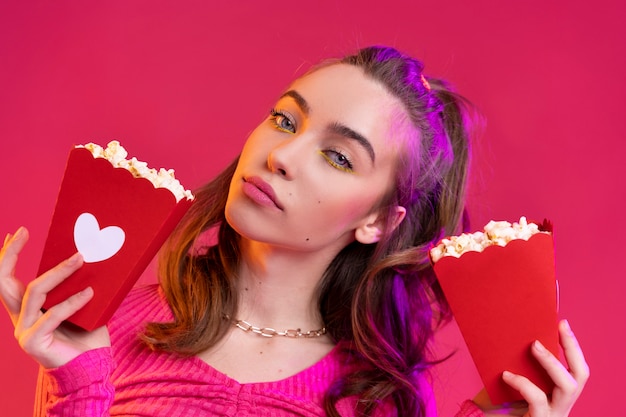 Close up teenager holding popcorn